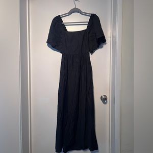 Black maxi dress with tie back closure and bell sleeves.  Size small